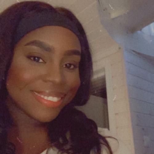 Front of zip tote bag with white canvas, black canvas straps and handle, and black zipper pulls.