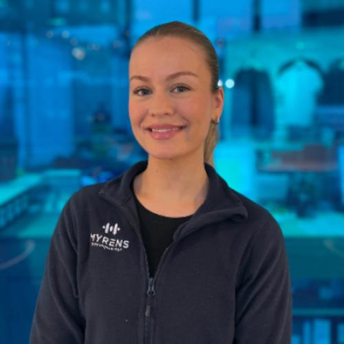 Front of zip tote bag with white canvas, black canvas straps and handle, and black zipper pulls.